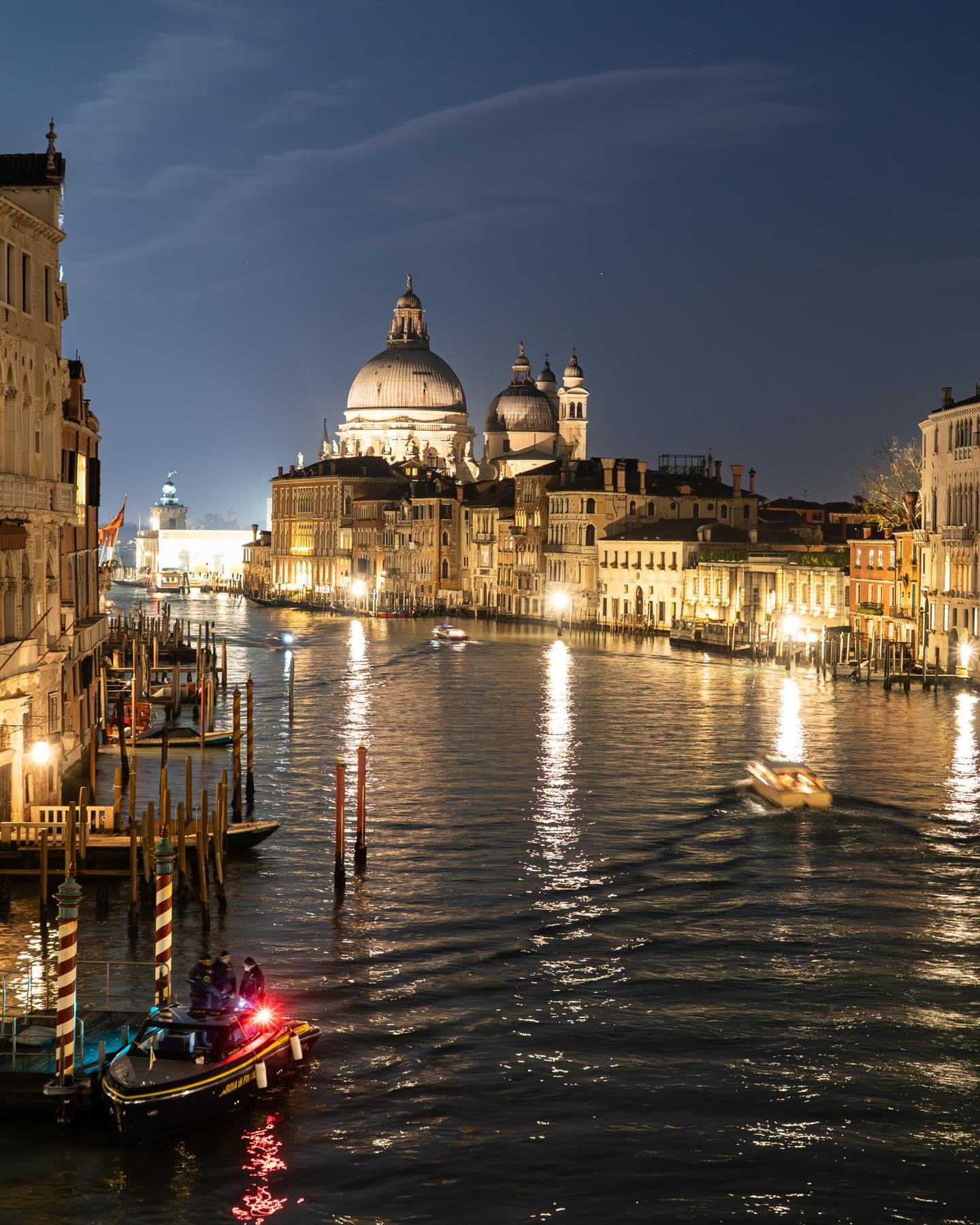 The Grand Canal at night, Santa Maria della Salute lit in the distance