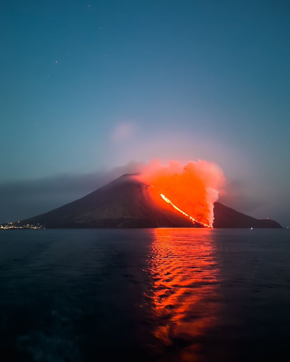 Mount Stromboli volcano erupting at night, Sicily, Italy